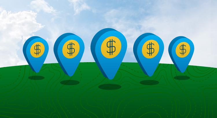 Three blue location markers with dollar signs against a green background and sky.