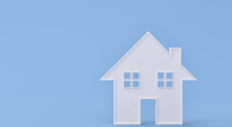 White house model on a blue background.