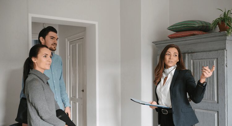 Two professionals discussing work in a modern office.