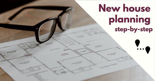 Blueprint of a new house plan with glasses on top.