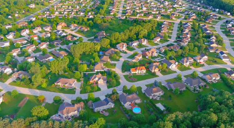 A suburban neighborhood with winding streets and green spaces.