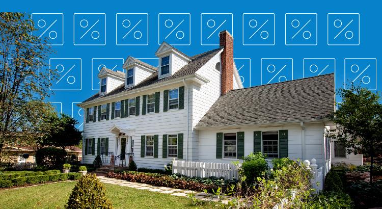 A charming white colonial house with green shutters and a manicured lawn.