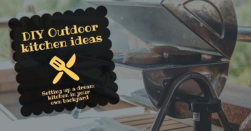 A promotional sign for outdoor kitchen ideas on a table beside a grill.